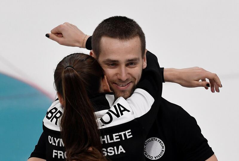 FILE PHOTO - Curling – Pyeongchang 2018 Winter Olympics – Mixed Doubles Bronze Medal Match - Olympic Athletes from Russia v Norway - Gangneung Curling Center - Gangneung, South Korea – February 13, 2018 - Alexander Krushelnitsky and Anastasia Bryzgalova, Olympic athletes from Russia, celebrate winning bronze. REUTERS/Toby Melville/File Photo