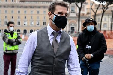 Tom Cruise wears a face mask during the shooting of 'Mission: Impossible 7' at Piazza Venezia in Rome, Italy, on November 29, 2020. EPA