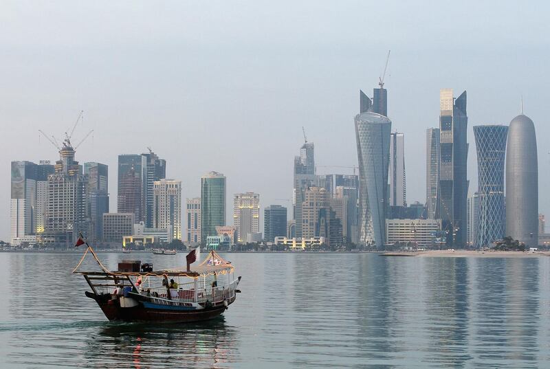 DOHA, QATAR - JANUARY 04:  View of the skyline of the West Bay area in Doha with a dhau boat is taken on January 4, 2011 in Doha, Qatar. The International Monetary Fund (IMF) recently reiterated its projection for the Qatari economy with predictions of double digit growth for 2010 and 2011. Though natural gas and petroleum production are still the biggest two single sources of income, the non-energy sector overtook oil and gas in Qatari GDP for 2009. Qatar is heavily dependant on foreign labour from countries such as India, Sri Lanka, Bangladesh, the Phillipines and other Arab countries. Foreigners make up approximately two thirds of the Qatari population. The FIFA world cup 2022 will takes place in Qatar.  (Photo by Christof Koepsel/Getty Images)