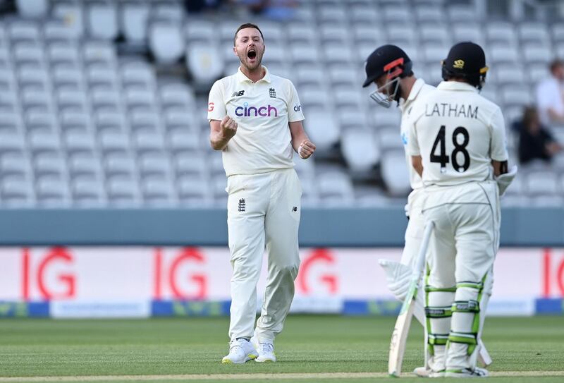 Ollie Robinson of England celebrates the successful review to dismiss Kane Williamson.