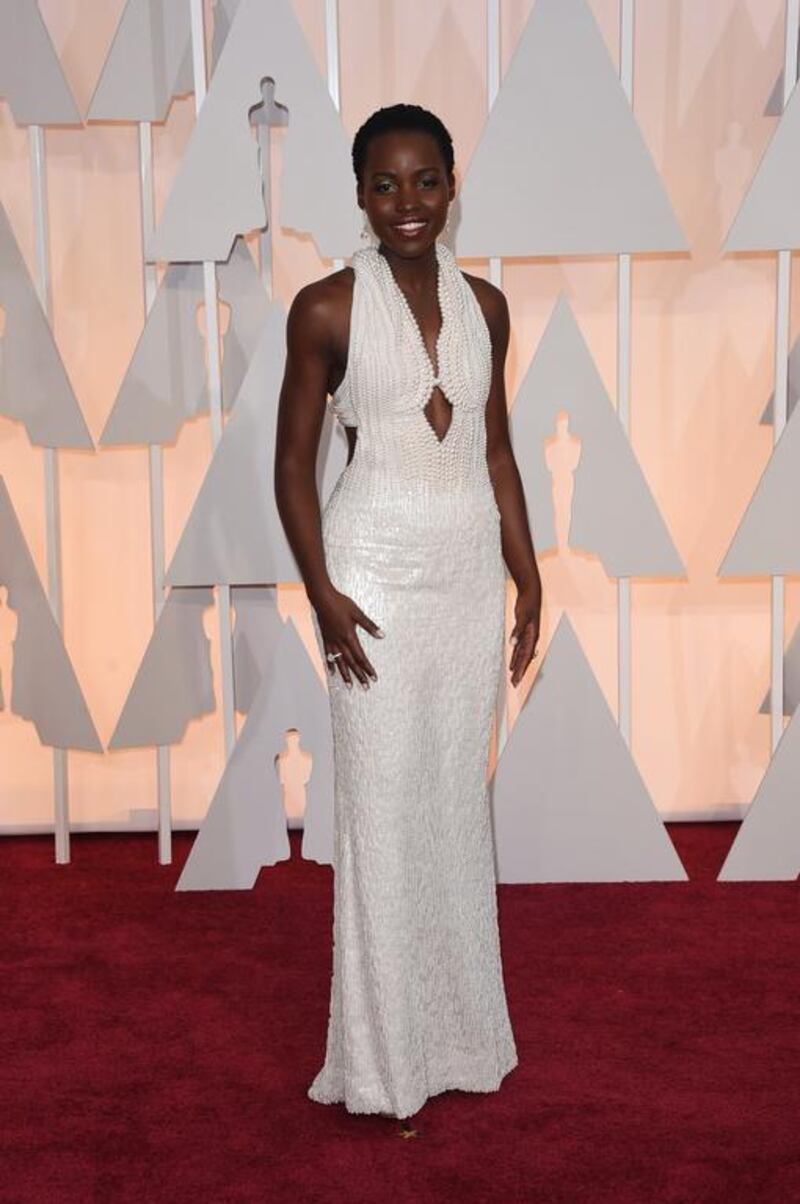 6,000 pearls were used for Lupita Nyong’o’s custom-made Calvin Klein dress. The wraparound neckline, bare shoulders and diamond-shaped peephole saved the dress from being too heavy on her tiny frame. Jason Merritt / Getty Images / AFP