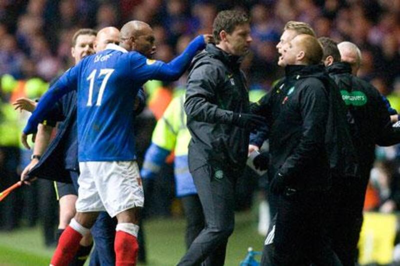 Rangers' El Hadji Diouf squares up to Celtic manager Neil Lennon.