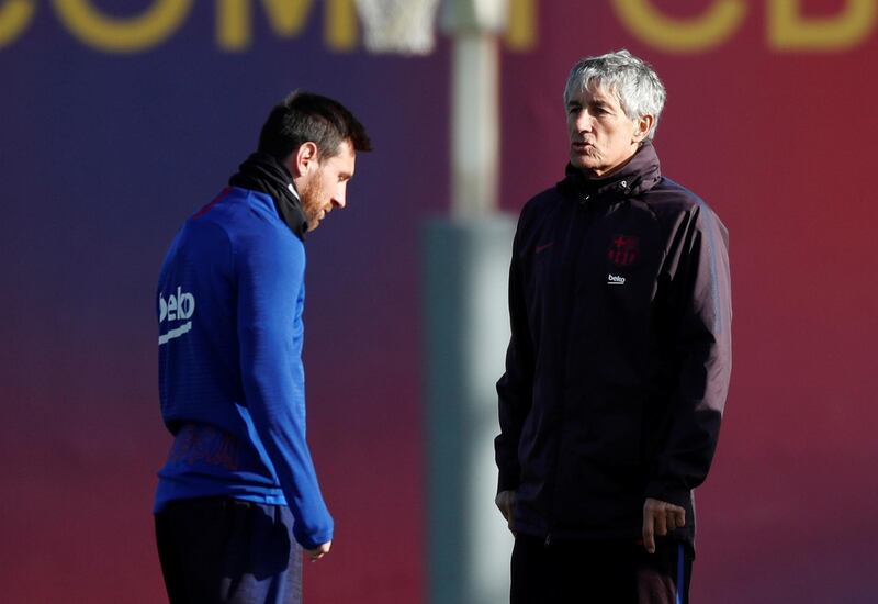 Barcelona manager Quique Setien talks with Lionel Messi during a training session at Joan Gamper Sports City. Reuters