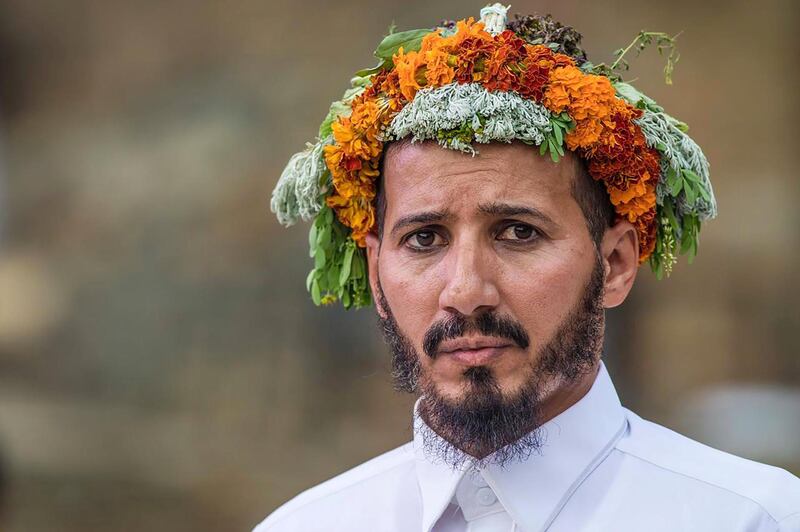 Today, the men still uphold their traditions by wearing garlands in their hair, while working as drivers, soldiers, farmers, and in the tourism industry.