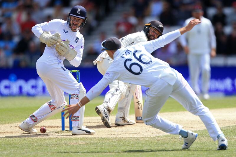 England's Joe Root is unable to get a hand to an edge from New Zealand's Tom Blundell. AFP