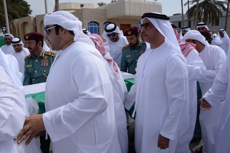Sheikh Saif bin Zayed, Deputy Prime Minister and Minister of Interior, front right, carries the coffin of First Lieutenant Tariq Al Shehi who was buried on March 4 after dying in a Bahrain bomb blast. Courtesy Security Media 