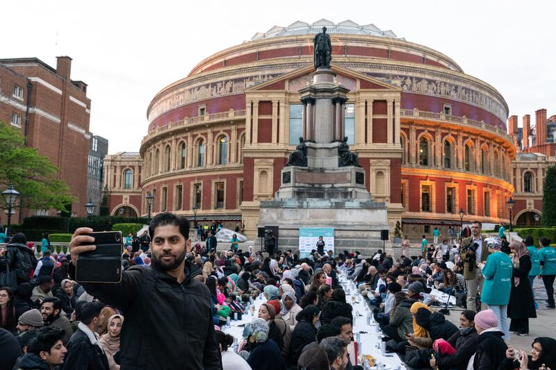 People gather at the UK's largest open Iftar organised by the Ramadan Tent Project, on the steps of the Royal Albert Hall, London on Wednesday. PA Wire