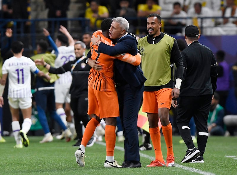 Al Ain's Khalid Eisa and manager Hernan Crespo celebrate after Soufiane Rahimi's second goal. Reuters