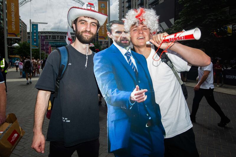 Fans arrive at Wembley stadium ahead of the Euros football final between England and Italy.