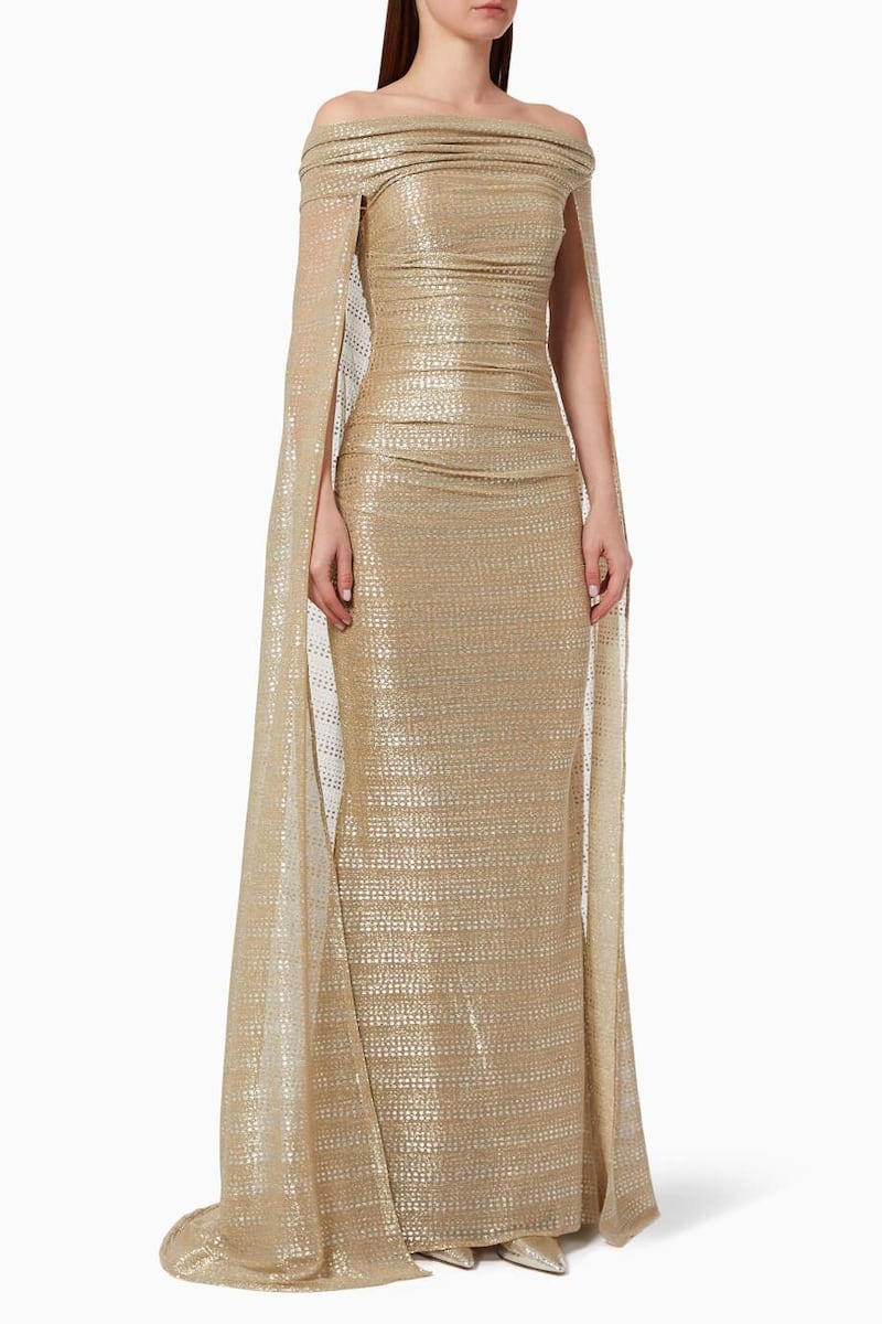 White tie: Off-shoulder gown in antique gold, Dh8,075, by Talbot Runhof, at Ounass. Photo: Ounass.com