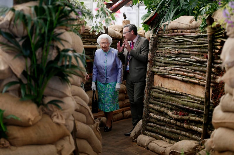 Queen Elizabeth looks at the Birmingham City Council garden in 2014. Getty Images