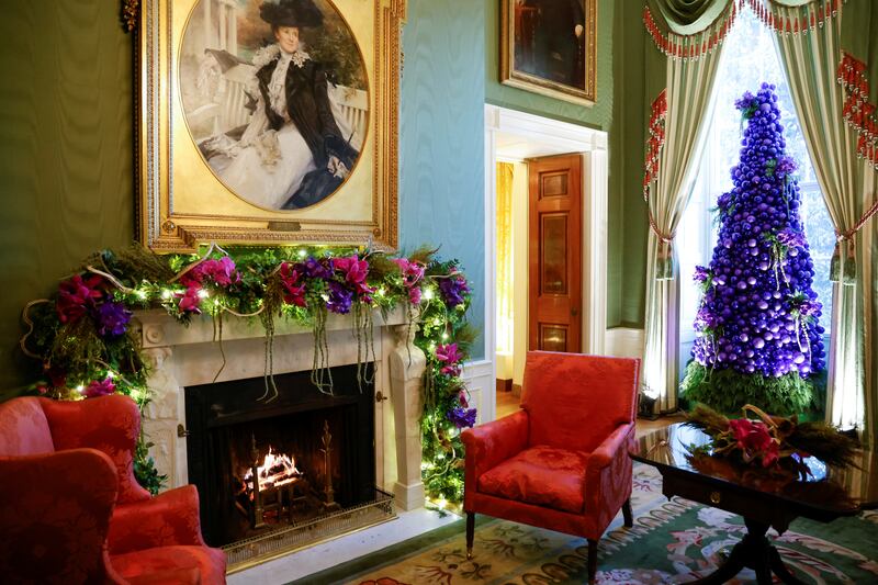 A tree of purple ornaments and natural orchids decorates the Green Room. Reuters