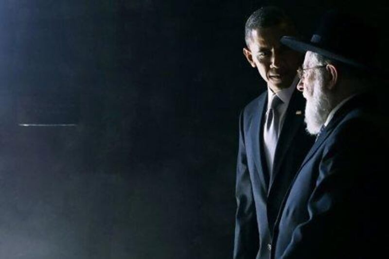 US President Barack Obama walks with Rabbi Israel Meir Lau during a visit to the Yad Vashem Holocaust Memorial last week, where he made an appeal for Israelis and Palestinians to resume peace talks. Jason Reed / Reuters
