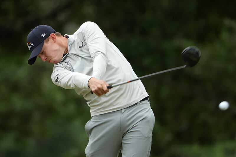 Matt Fitzpatrick of England plays his shot from the fourth tee. AFP
