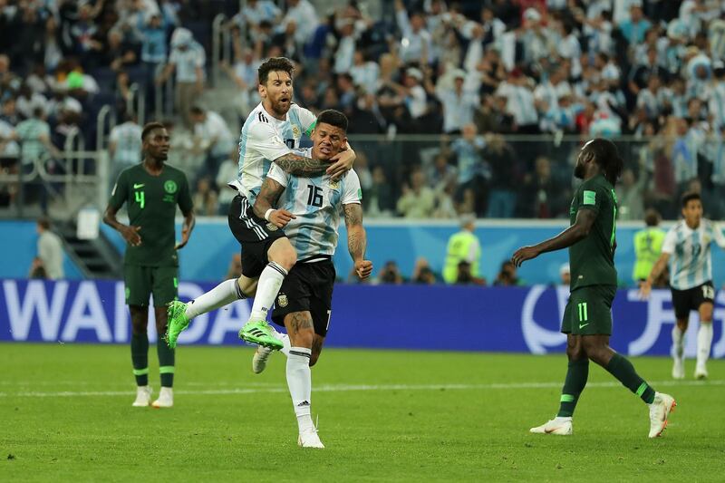 Marcos Rojo of Argentina celebrates with teammate Lionel Messi after scoring his team's second goal during the 2018 FIFA World Cup Russia group D match between Nigeria and Argentina. Richard Heathcote / Getty Images