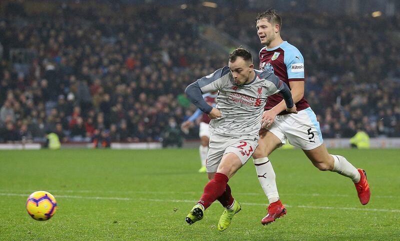 Liverpool's Xherdan Shaqiri scores his side's third goal of the game against Burnley, during their English Premier League soccer match at Turf Moor in Burnley, England, Wednesday Dec. 5, 2018. (Nigel French/PA via AP)