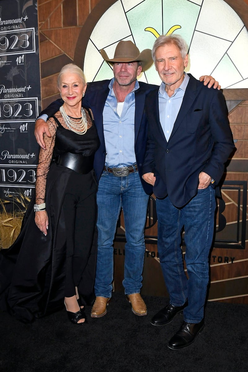 LAS VEGAS, NEVADA - DECEMBER 03: (L-R) Helen Mirren, Taylor Sheridan, and Harrison Ford attend Paramount+'s "1923" Las Vegas Premiere at the Encore Theater at Wynn Las Vegas on December 03, 2022 in Las Vegas, Nevada.    Mindy Small / Getty Images / AFP (Photo by Mindy Small  /  GETTY IMAGES NORTH AMERICA  /  Getty Images via AFP)