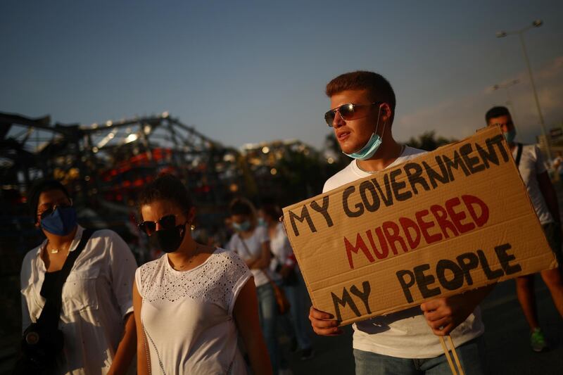 People take part in a vigil for the victims of the massive explosion, in Beirut. Reuters