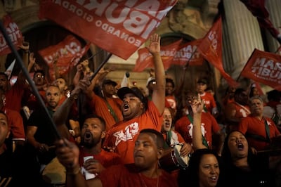 Supporters shout slogans before the arrival of Fernando Haddad, Workers' Party presidential candidate, in downtown Rio de Janeiro. AP