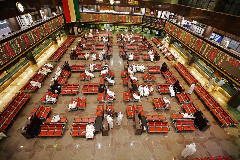 Traders follows the stock market at Boursa Kuwait, the national stock market of Kuwait, on September 19, 2019 in Kuwait City. Saudi shares slumped at the start of trading on September 15, the first session after drone attacks on two major oil facilities knocked out more than half the OPEC kingpin's production. Other bourses in the Gulf also dropped. Dubai Financial Market was down 1.1 percent, Abu Dhabi and Qatar markets declined 0.4 percent each, while Kuwait shares sank 0.8 percent and Bahrain's bourse slid 0.9 percent. / AFP / Yasser Al-Zayyat
