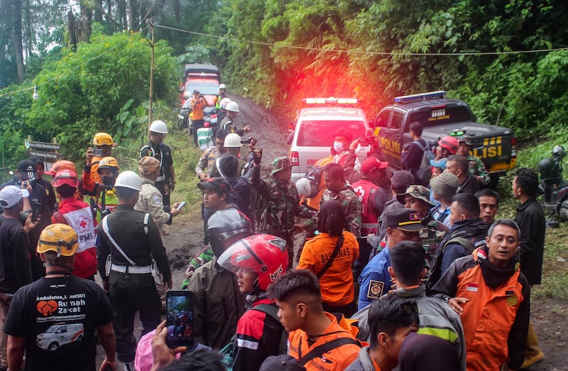 Indonesian rescuers prepare to evacuate a survivor off Mount Merapi after it erupted on Sunday in Agam. EPA