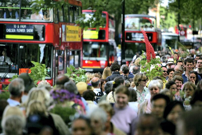 LONDON - MAY 28:  Garden enthusiasts queue for buses during the last day of the Royal Horticultural Society's Chelsea Flower Show on May 28, 2005 in London, England. (Photo by Daniel Berehulak/Getty Images)