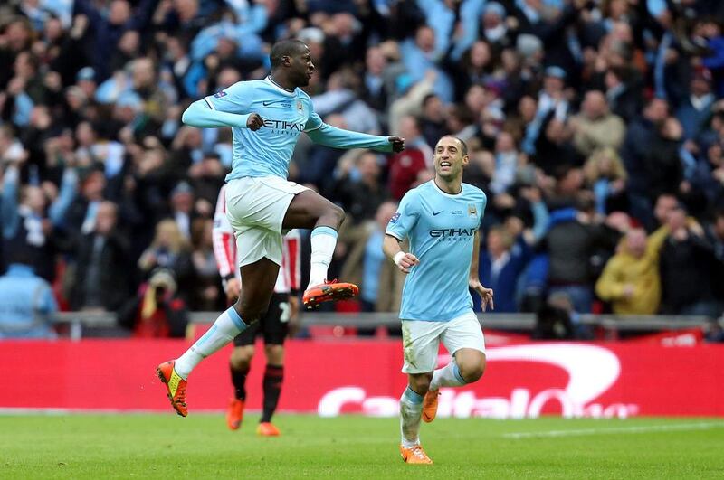 Manchester City's Yaya Toure, centre, celebrates his goal, City's first in a 3-1 win, against Sunderland in the League Cup final. Scott Heppell / AP