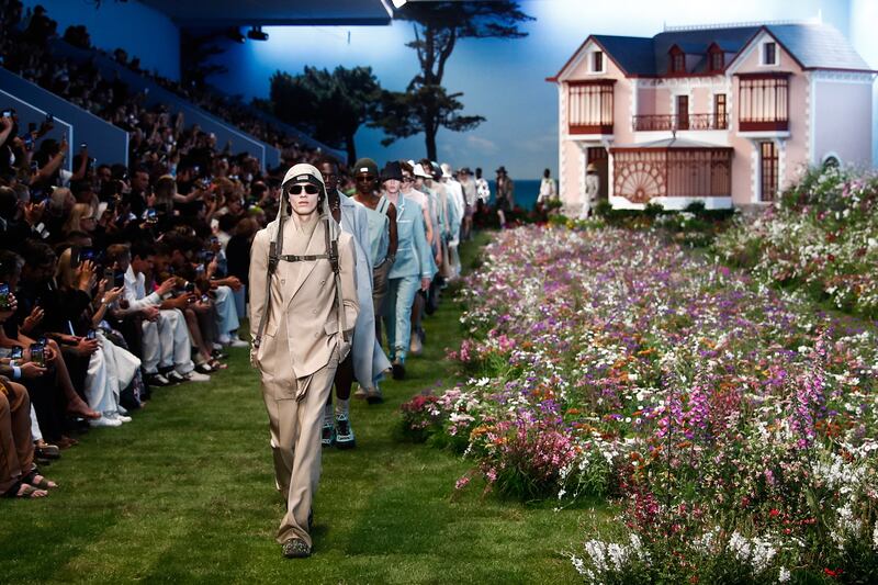 Models present creations from the spring/summer 2023 men's collection by designer Kim Jones for Dior Homme during Paris Fashion Week. EPA