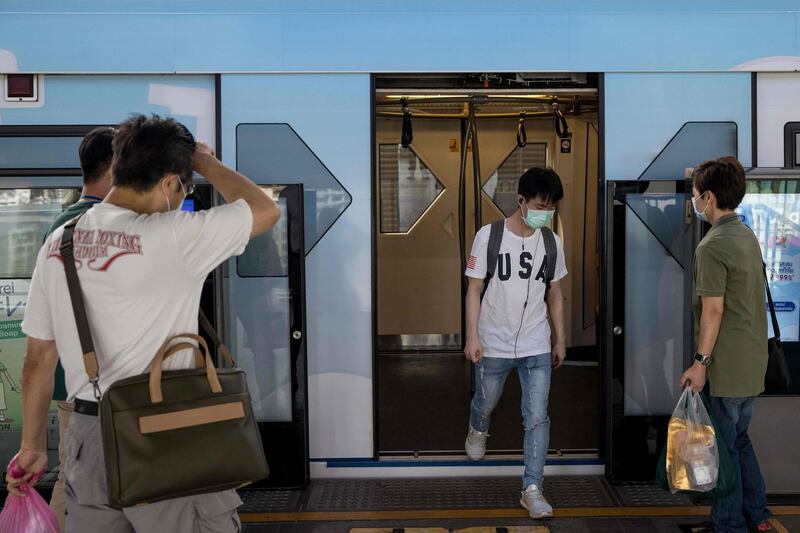 A commuter exits a BTS train in Bangkok, Thailand. AFP