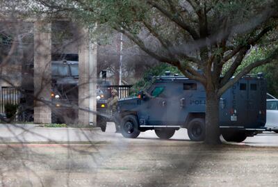 Law enforcement teams gather near Congregation Beth Israel in Colleyville, Texas. AP