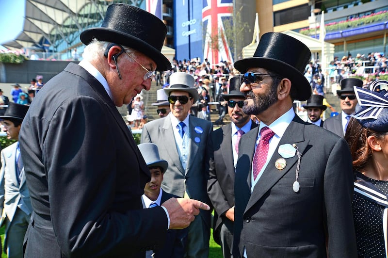 Mandatory Credit: Photo by Pat Healy/Racing Fotos/Shutterstock (8873575r)
ROYAL ASCOT. THE ST JAMES'S PALCE STAKES. Godolphin owner SHEIKH MOHAMMED is congratulated by Coolmore owner, JOHN MAGNIER after BARNEY ROY won.
Royal Ascot, Day One, UK - 20 Jun 2017