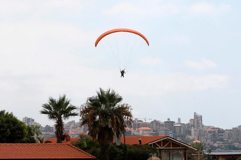 Paragliders fly over the Lebanese coastal city of Jounieh, north of the capital Beirut. AFP