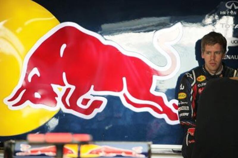 Sebastian Vettel sits in the Red Bull Racing team pit during yesterday’s practice at the Yas Marina Circuit in Abu Dhabi.