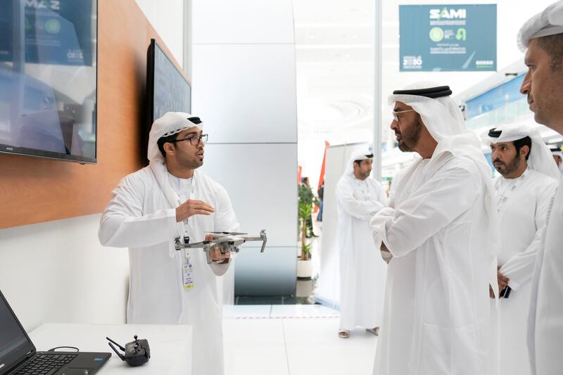 ABU DHABI, UNITED ARAB EMIRATES - February 20, 2019: HH Sheikh Mohamed bin Zayed Al Nahyan, Crown Prince of Abu Dhabi and Deputy Supreme Commander of the UAE Armed Forces (2nd L) visits Khalifa University stand, during the 2019 International Defence Exhibition and Conference (IDEX), at Abu Dhabi National Exhibition Centre (ADNEC).
( Ryan Carter for the Ministry of Presidential Affairs )
---