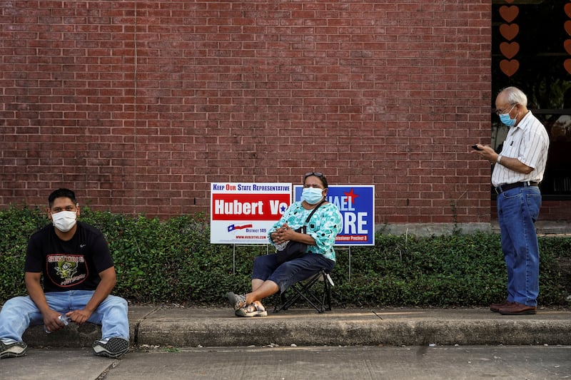 People wait to cast their ballots for the 2020 presidential election in Houston, Texas, US, on October 13, 2020. Reuters