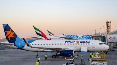 An Israir A320 is parked beside Emirates jets at Dubai International Airport. Dubai Media Office