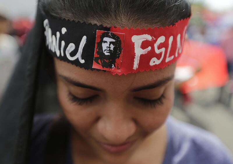 A supporter of Nicaraguan President Daniel Ortega takes part in a pro-FSLN government rally on National Mothers Day at the Rotonda Hugo Chavez in Managua. Inti Ocon / AFP