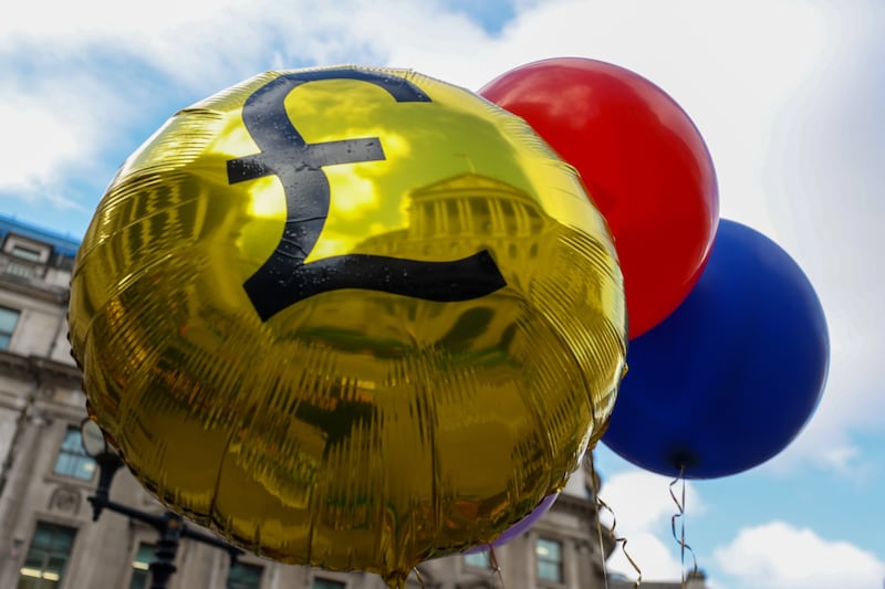 Balloons carried by demonstrators during a protest against the Bank of England's approach to fighting inflation. Bloomberg