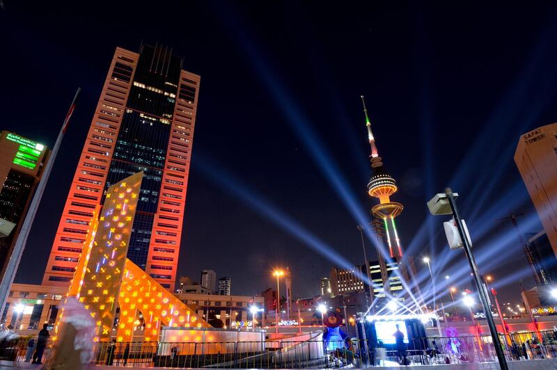 epa07386342 Kuwait City's Buildings and Liberation tower decorated with lights, Kuwait City, Kuwait, 21 February 2019. Kuwait to mark its national and liberation days on 25 and 26 February. The National Day commemorates the creation of Kuwait as a nation in 1961 while Liberation Day marks the end of the Iraqi occupation in 1991 during the Gulf War.  EPA/NOUFAL IBRAHIM