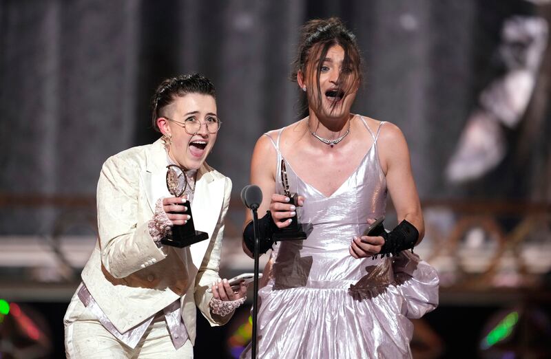 Lucy Moss, left, and Toby Marlow accept the award for Best Original Score for "SIX: The Musical". AP