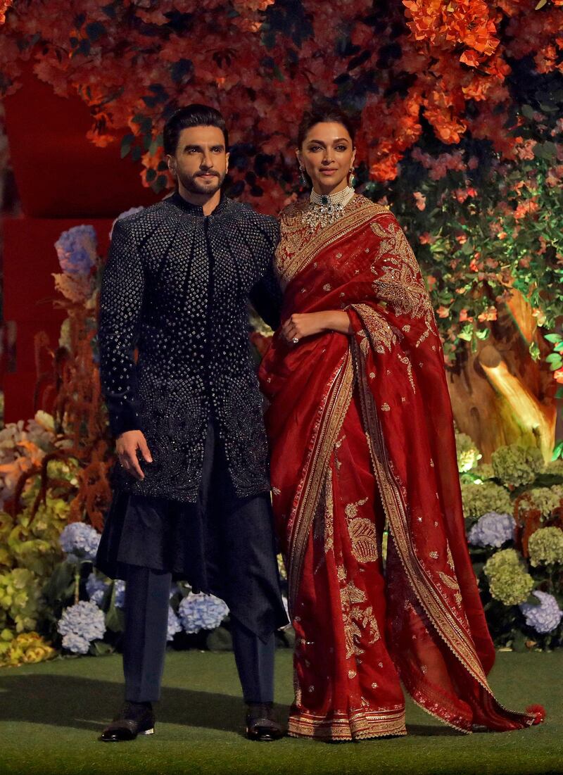 Actor Ranveer Singh and his wife actor Deepika Padukone at the engagement party. Reuters