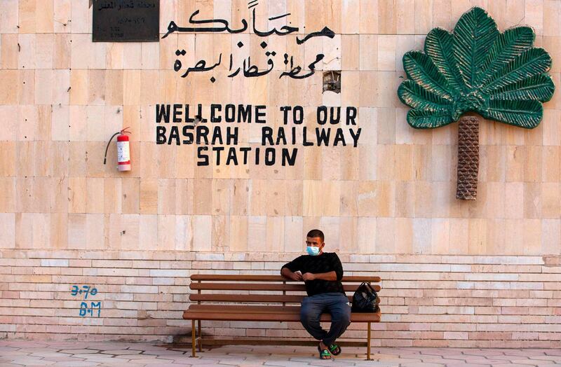 An Iraqi man sits at the train station in the southern city of Basra. AFP