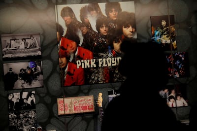 A woman is silhouetted at an exhibition of Pink Floyd at the V&A Museum in London. Reuters.