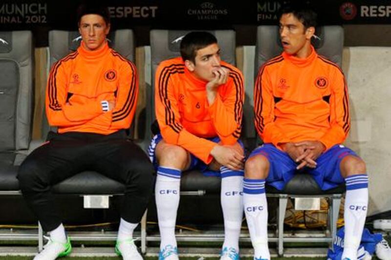 Chelsea's Fernando Torres, left, Paulo Ferreira, center, and Oriol Romeu sit on the bench during the Champions League final soccer match between Bayern Munich and Chelsea in Munich, Germany Saturday May 19, 2012. (AP Photo/Matt Dunham)