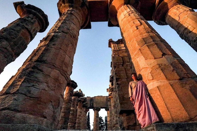 An actress in costume poses next to a column during the filming of a television production at the Temple of Zeus in the ruins of Libya's eastern city of Cyrene. The remains of the ancient Greek city survived Libya's 2011 revolution and a decade of lawlessness. Today, they face new threats: plunder and bulldozers. Unesco added Cyrene to its World Heritage List in 1992. AFP