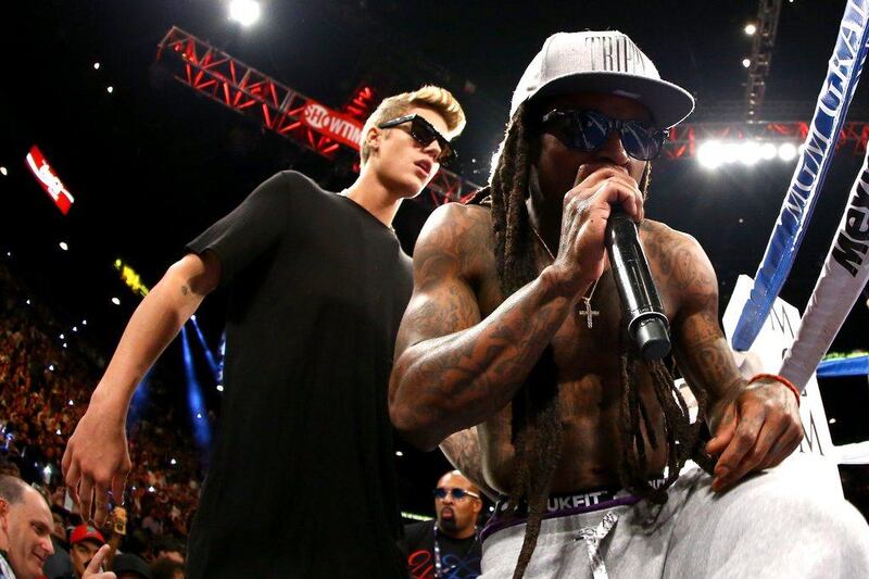 Singers Justin Bieber, left, and Lil Wayne perform during the night, hype for which was being created for the past few months. Al Bello / Getty Images / AFP