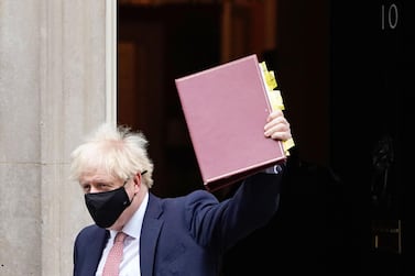 Britain's Prime Minister Boris Johnson, wearing a face covering due to the COVID-19 pandemic, leaves 10 Downing Street in central London on October 7, 2020, to attend the weekly session of Prime Minister's Questions (PMQs) at the House Commons. Britain has suffered the worst death toll in Europe from the novel coronavirus COVID-19 outbreak, with more than 42,000 confirmed deaths. / AFP / Niklas HALLE'N