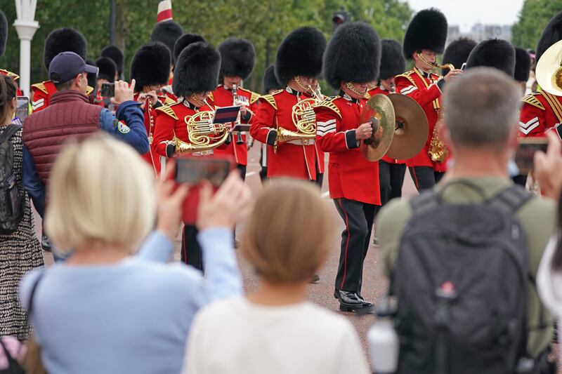 Crowds gather to watch the return of the Changing the Guard ceremony. PA