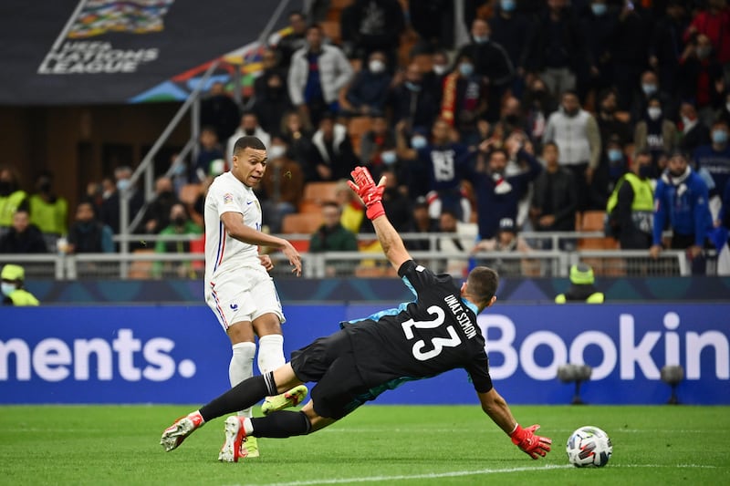 Kylian Mbappe fires the ball past Spain' goalkeeper Unai Simon to score his team's second goal. AP