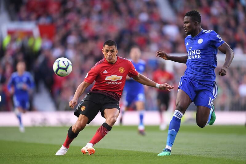 Manchester United's Alexis Sanchez battles for possession with Leicester's Daniel Amartey. Getty Images